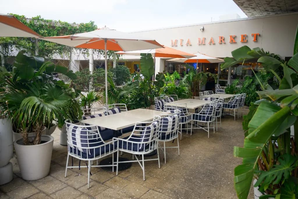 Mia Market patio with orange umbrellas