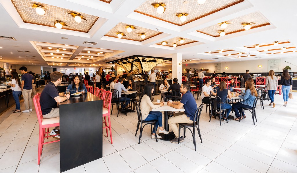 Guests dining at Mia Market during a private event